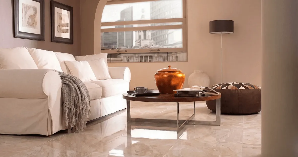 Modern living room with professionally installed marble flooring, a beige sofa, coffee table in Columbus, OH